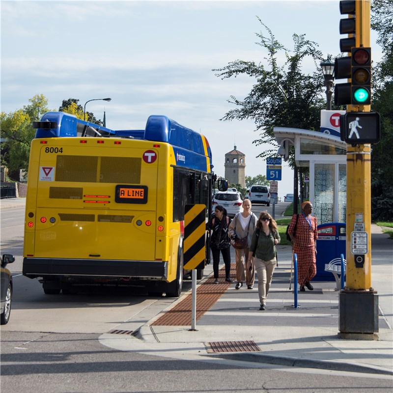 People departing an A Line bus at station