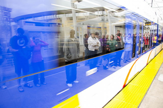 Customers wait to board a light-rail train at Target Field Station.