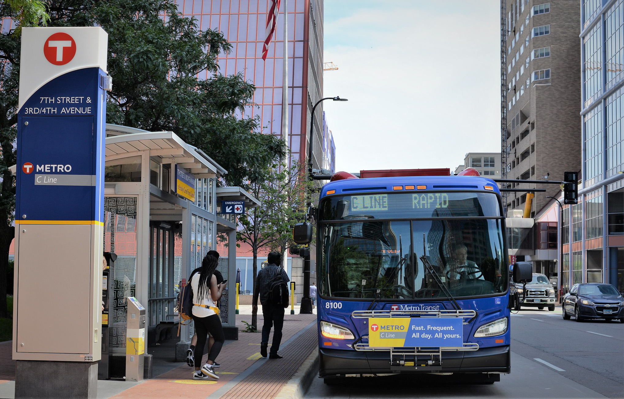 Customers board a METRO C Line bus in downtown Minneapolis. 