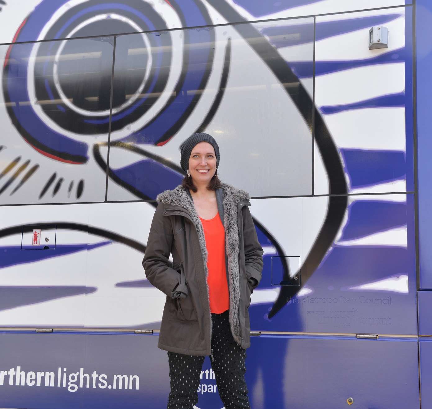 Artist Andrea Carlson with the "Water is Life"  train artwork she designed for Northern Spark 2017. 