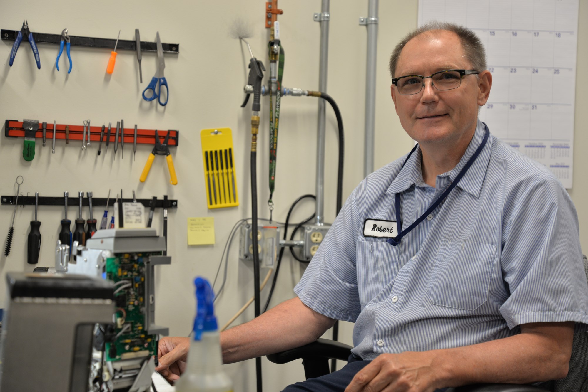 Farebox Technician Robert Koehnen at his workstation, where he maintains and repairs farebox equipment.