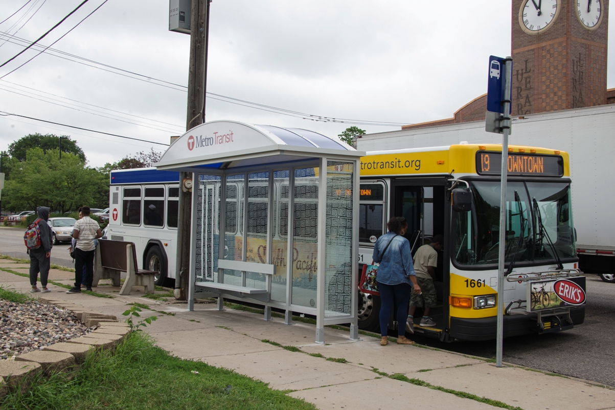 The “slim shelters” are two feet deep at the base but still have the standard four-foot deep rooftop to provide shade and protection from the elements. The shelters will also have a small bench and a location for transit information.