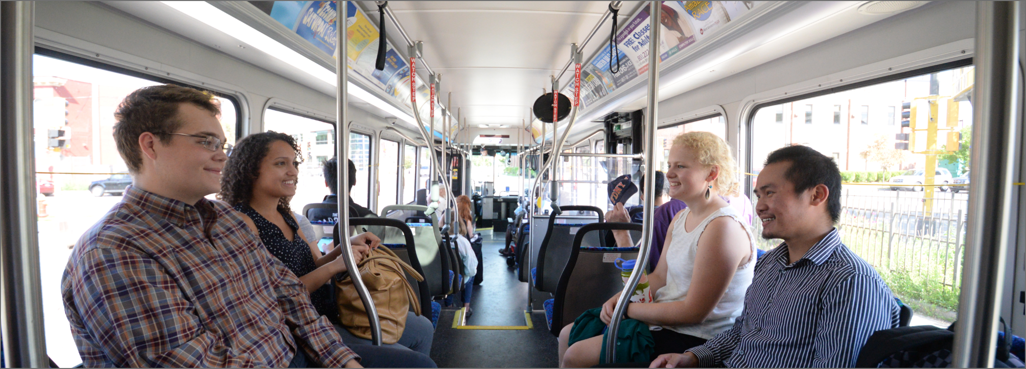 Group of diverse employees riding the train