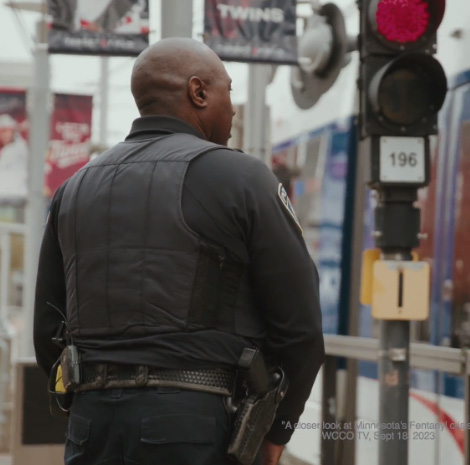 Metro Transit police officer waiting for the lightrail.